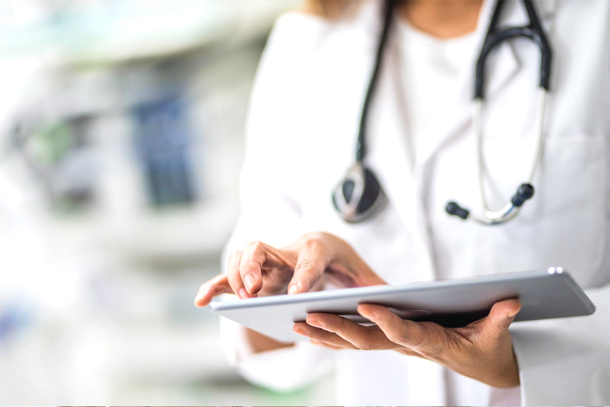 physician using laptop