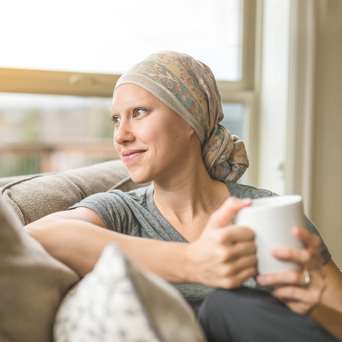 Female oncology patient looking out the window