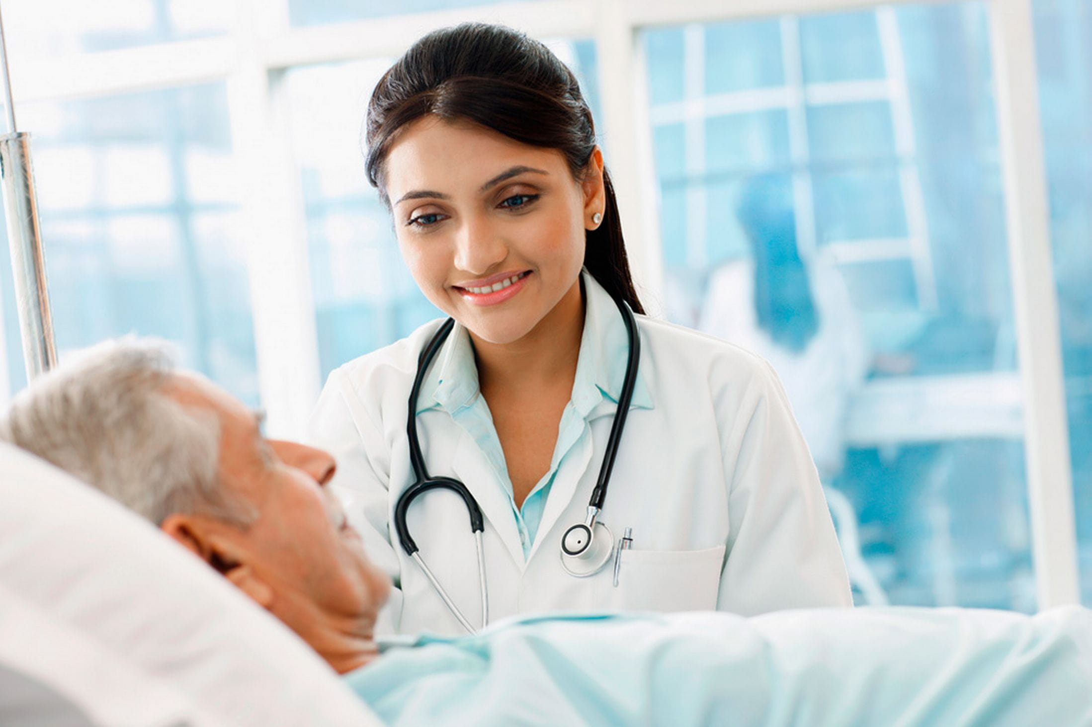 Nurse looking at a patient.